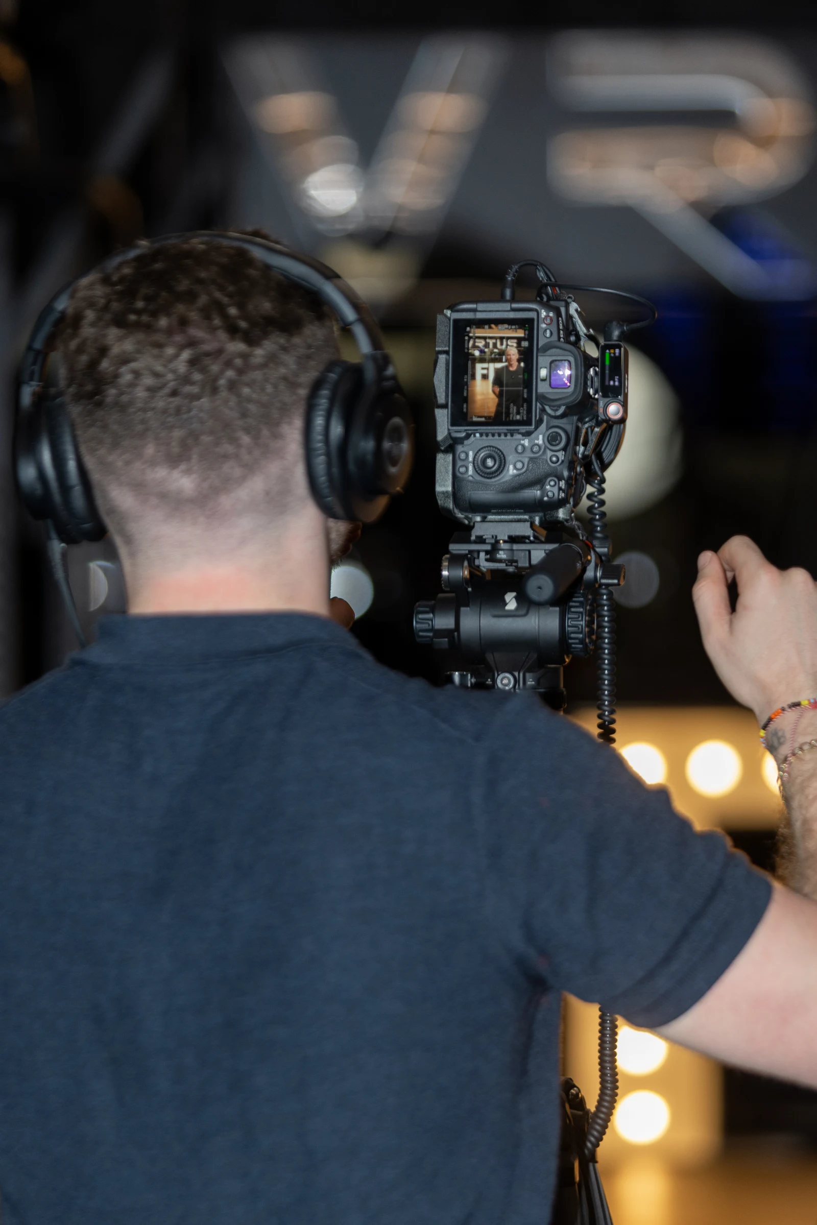 Behind the scenes filming with camera and headphones